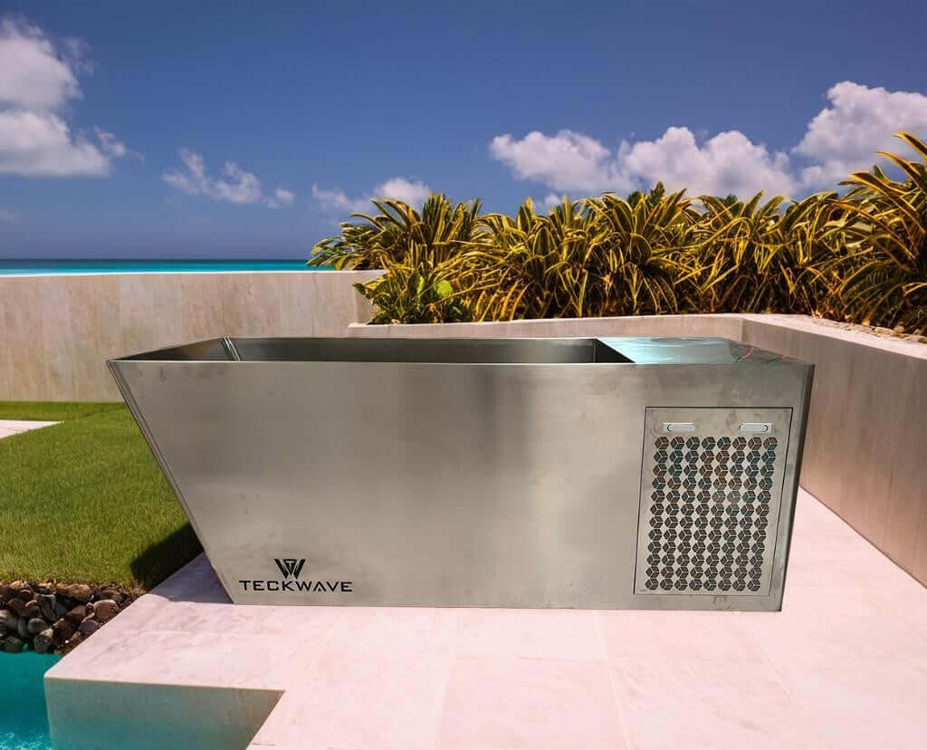 Integrated all-in-one teckwave ice bath with stainless steel body and chiller in a modern outdoor setting.